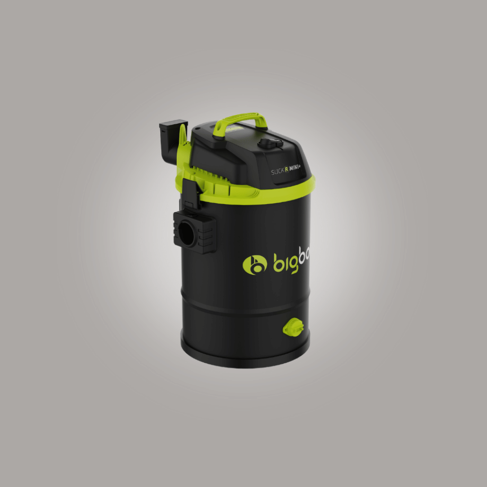 Black and green vacuum cleaner on a gray background