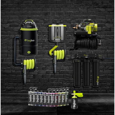 Collection of BigBoi brand automotive tools and equipment against a black brick wall.