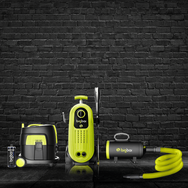 Bigboi weekend warrior pressure washer kit with accessories on a black brick wall background