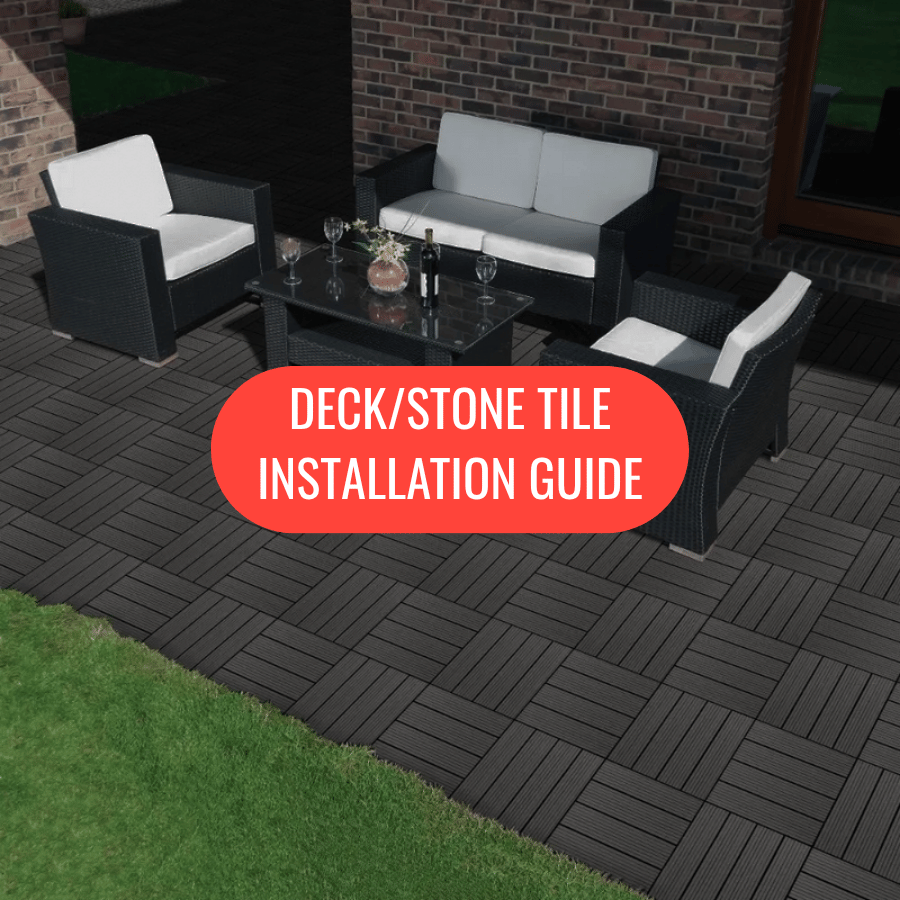 Outdoor patio setup with furniture on a deck made of black interlocking tiles.