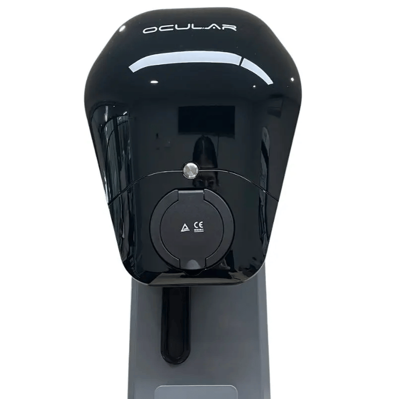 Black Ocular EV charger on a gray stand, photographed against a plain white background.