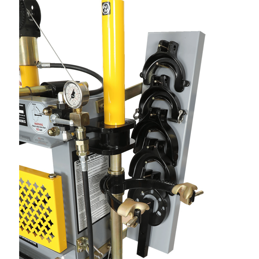 Spring compressor with yellow and black components on a white background