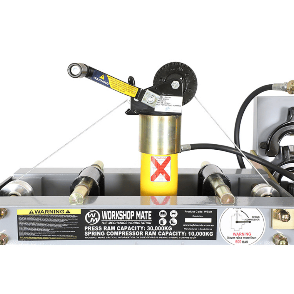Workshop Mate spring compressor with warning labels on a white background