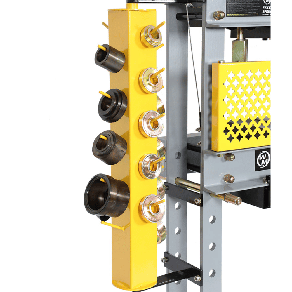 Yellow and gray mechanical device with multiple components on a white background