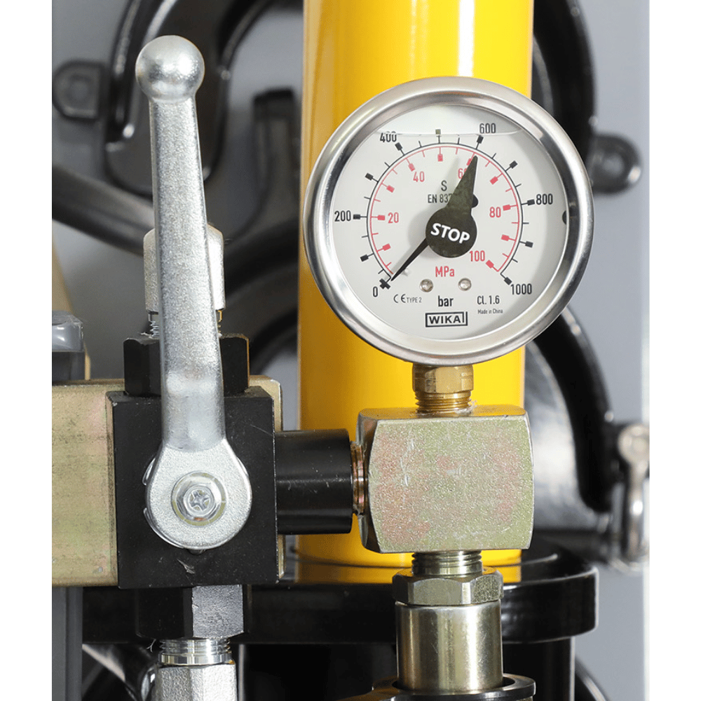 Pressure gauge on a workshop mate with a yellow background