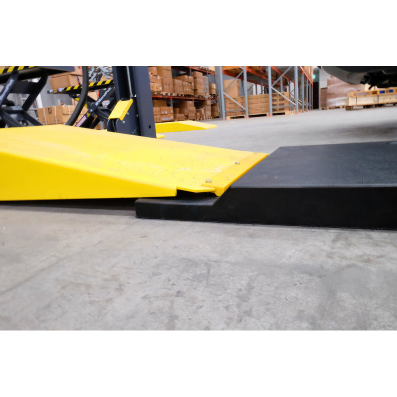 Side-on close view of a Liftmotive extension ramp against a lift ramp