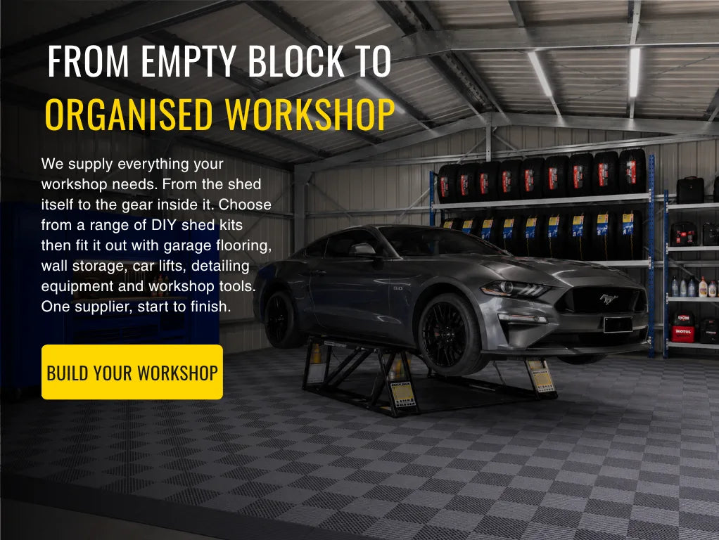 Workshop setup with car on lift and text about workshop supplies